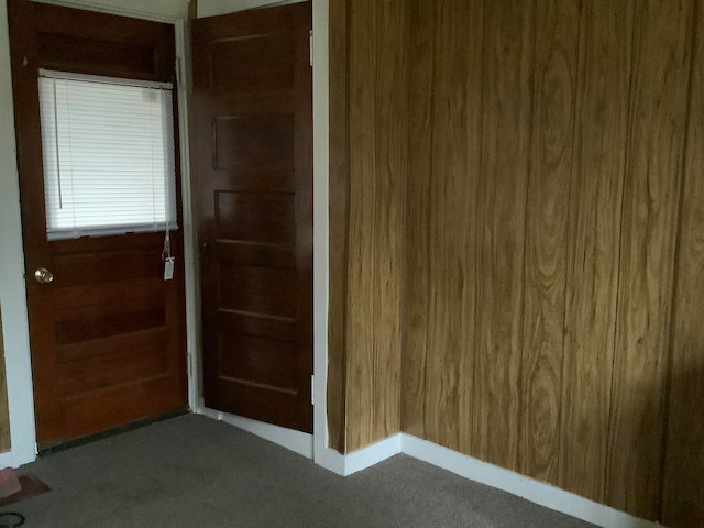 interior space featuring wood walls