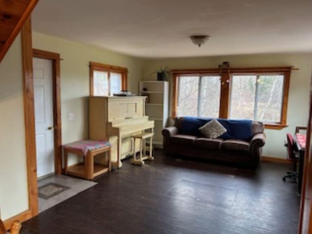 20 Monument Rd, Abbot, ME 04406 - living area featuring wood finished floors and baseboards
