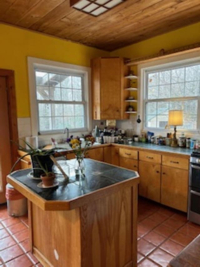 20 Monument Rd, Abbot, ME 04406 - kitchen with wooden ceiling, light tile patterned floors, a wealth of natural light, and open shelves