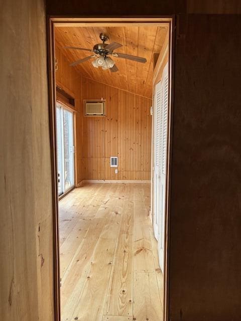 20 Monument Rd, Abbot, ME 04406 - empty room featuring wooden ceiling, light wood-style floors, ceiling fan, wooden walls, and lofted ceiling