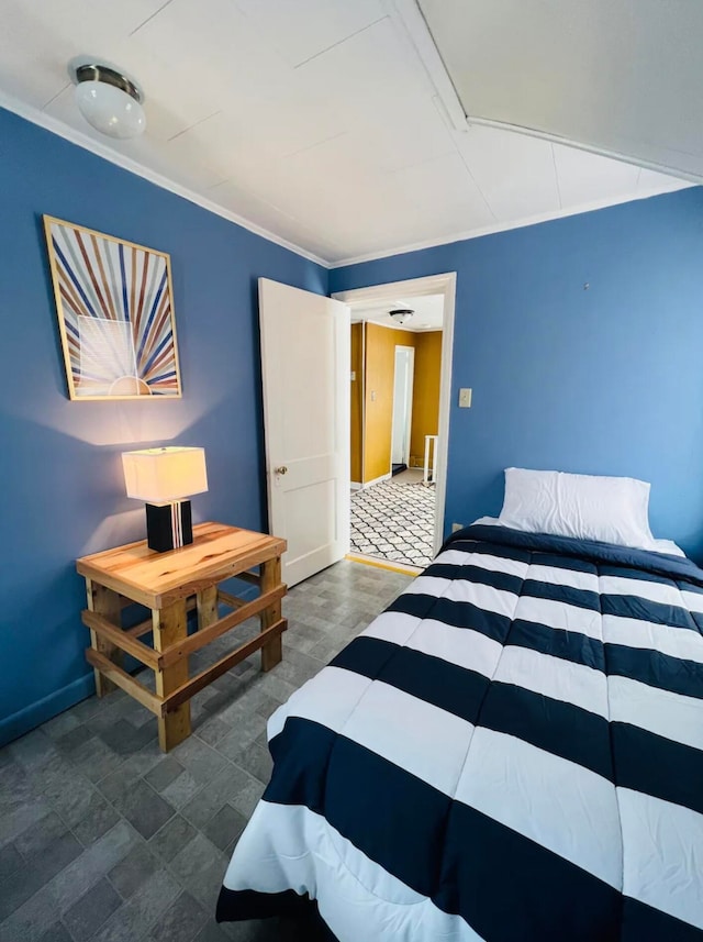 bedroom featuring crown molding