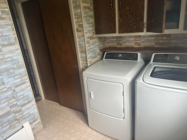 laundry room with cabinets and independent washer and dryer