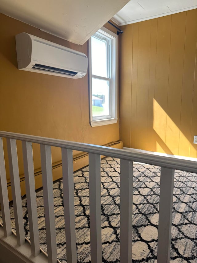 stairway with an AC wall unit and wood walls