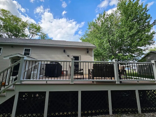 back of property featuring a wooden deck