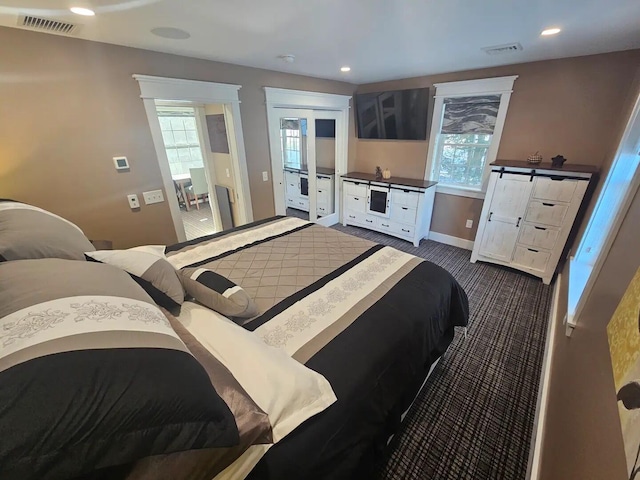 bedroom featuring dark colored carpet