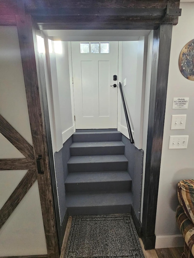 staircase featuring wood-type flooring