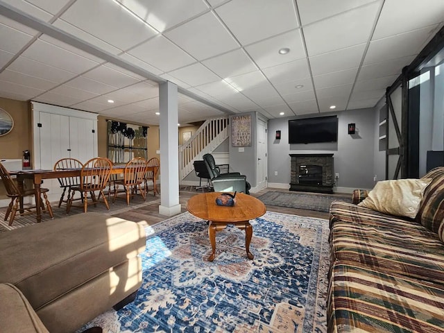 living room with a drop ceiling