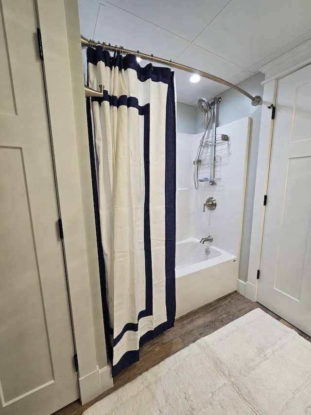 bathroom featuring shower / bath combo and wood-type flooring