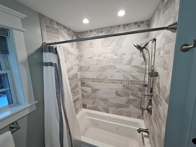 bathroom with shower / bath combo with shower curtain