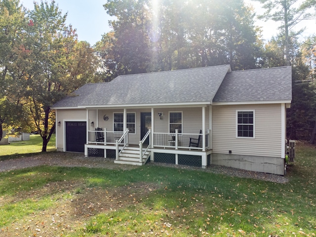 view of front of home featuring covered porch and a front lawn