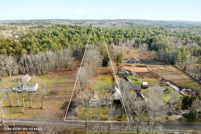 birds eye view of property with a rural view