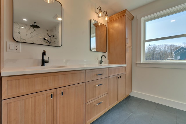 bathroom with tile patterned floors, vanity, and a shower