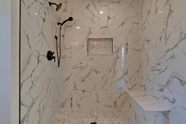 bathroom with tiled shower