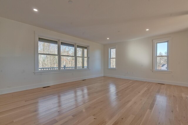 unfurnished room featuring light hardwood / wood-style flooring