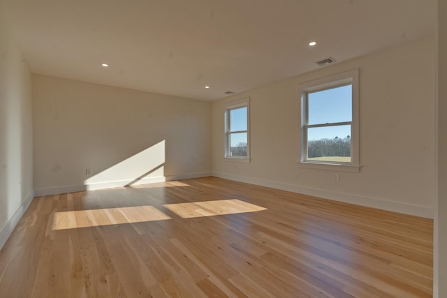 spare room with light wood-type flooring