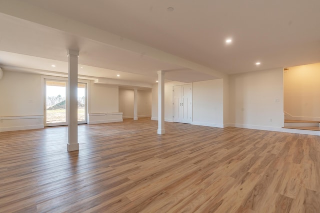 basement featuring light wood-type flooring