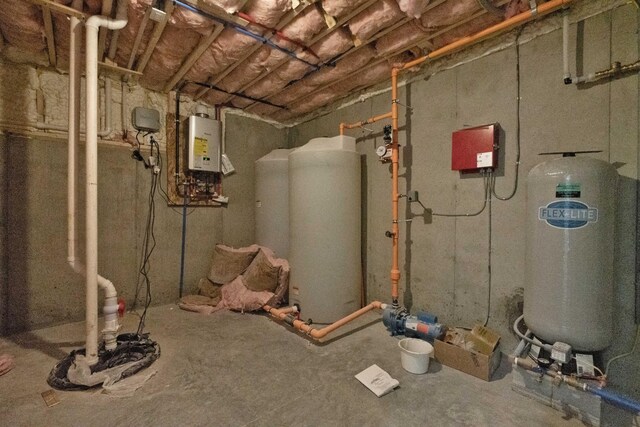 utility room featuring water heater