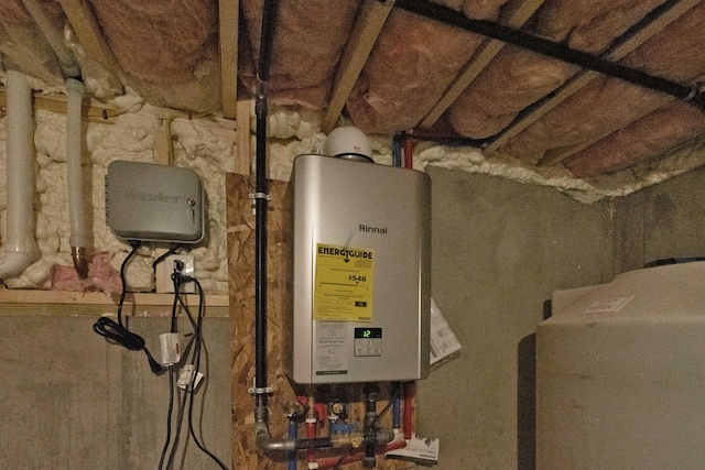 utility room featuring tankless water heater