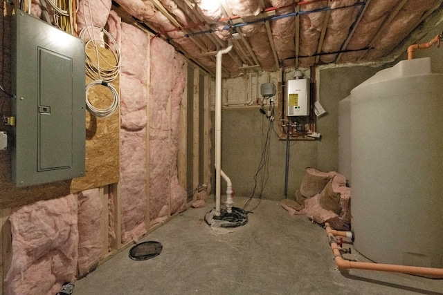 basement featuring electric panel and water heater