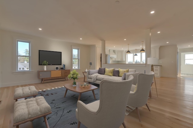 living room with plenty of natural light and light wood-type flooring