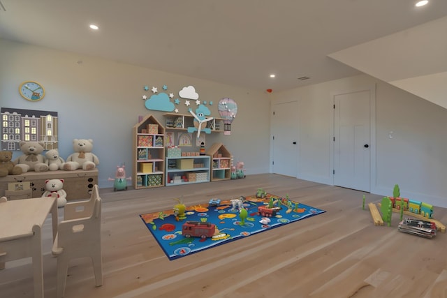 game room with wood-type flooring