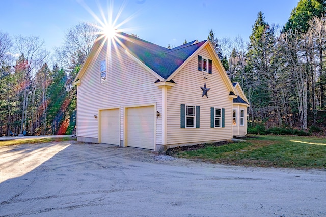 view of side of property with driveway