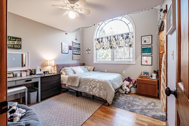 bedroom with wood finished floors and a ceiling fan