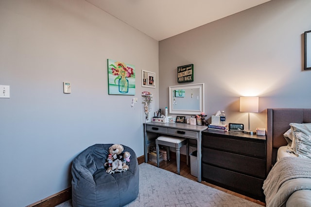 bedroom featuring dark wood finished floors and baseboards