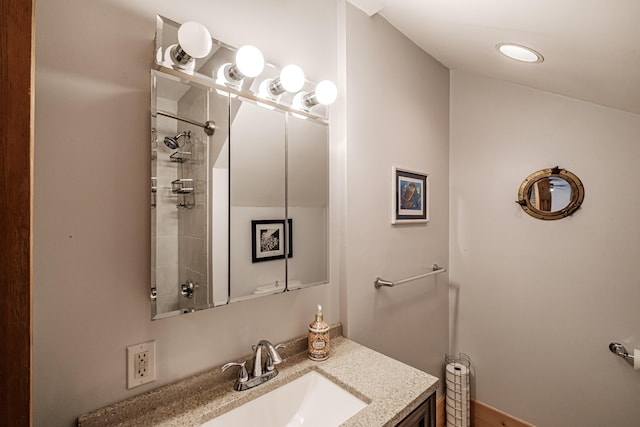 full bathroom featuring a shower and vanity