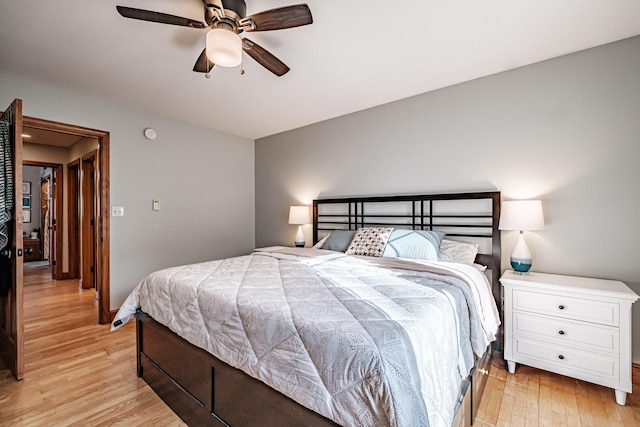 bedroom with light wood-style flooring and ceiling fan