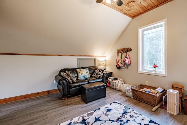 sitting room with wood finished floors, baseboards, wood ceiling, ceiling fan, and vaulted ceiling