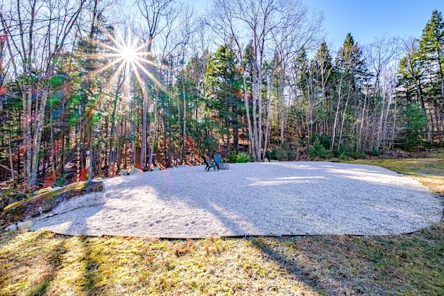 exterior space with a wooded view