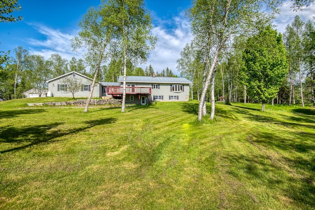 view of yard featuring a wooden deck