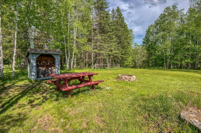 view of yard with a fire pit