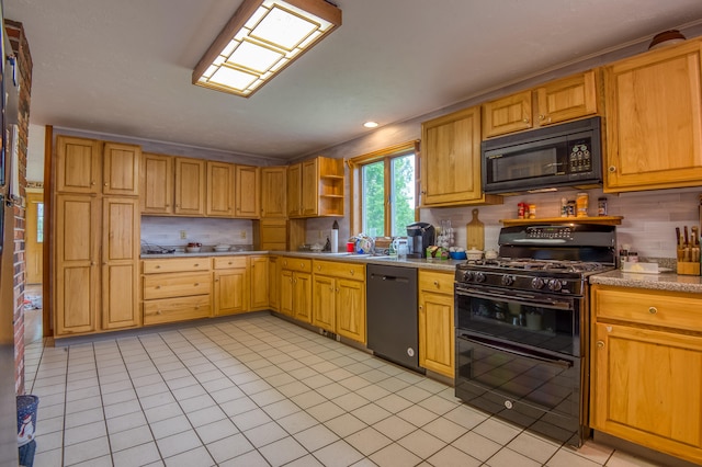 kitchen featuring tasteful backsplash, crown molding, light tile patterned floors, and black appliances