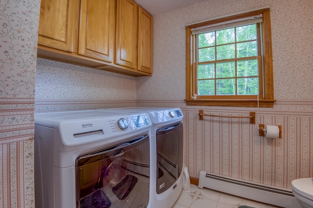 laundry room with independent washer and dryer, light tile patterned floors, and baseboard heating