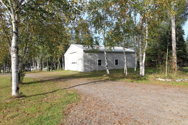 view of property exterior featuring an outdoor structure