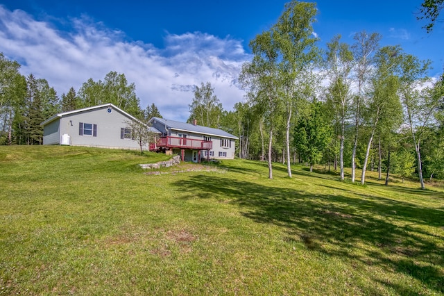 view of yard with a wooden deck