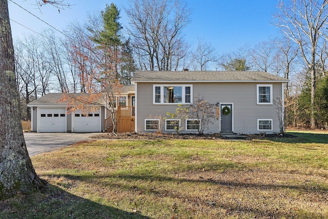 raised ranch with a front yard