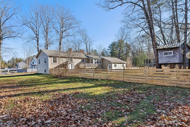 back of property featuring a lawn