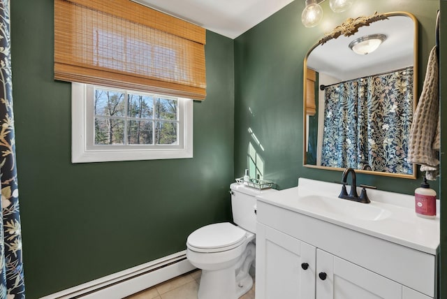 bathroom with tile patterned floors, vanity, toilet, and a baseboard heating unit