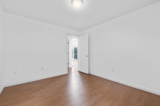 empty room with wood-type flooring