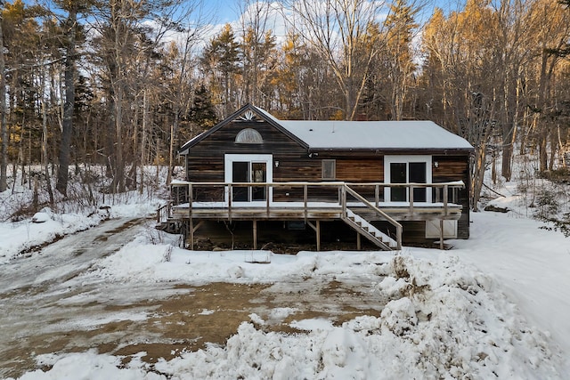 cabin with a wooden deck