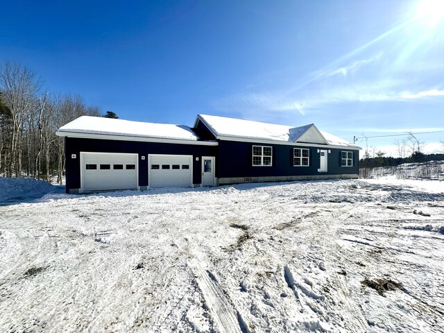 ranch-style house featuring an attached garage