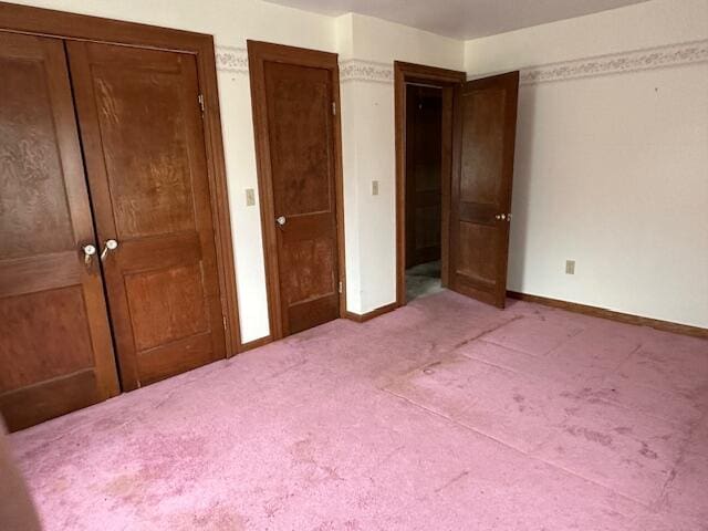 unfurnished bedroom featuring carpet