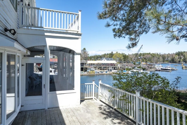 wooden terrace with a water view