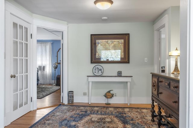 interior space with hardwood / wood-style floors and french doors