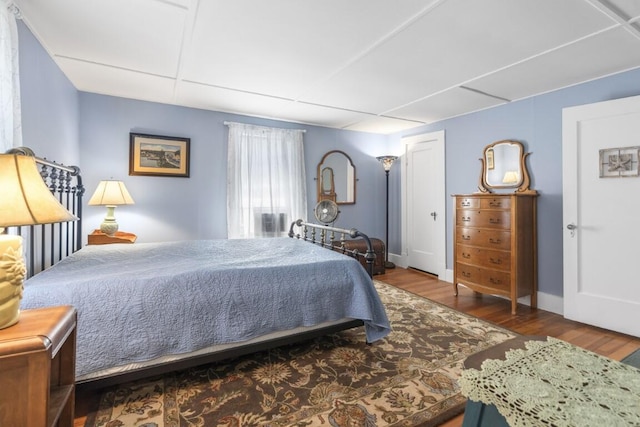 bedroom with hardwood / wood-style flooring