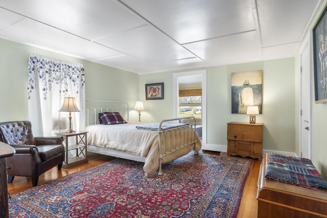 bedroom with hardwood / wood-style floors