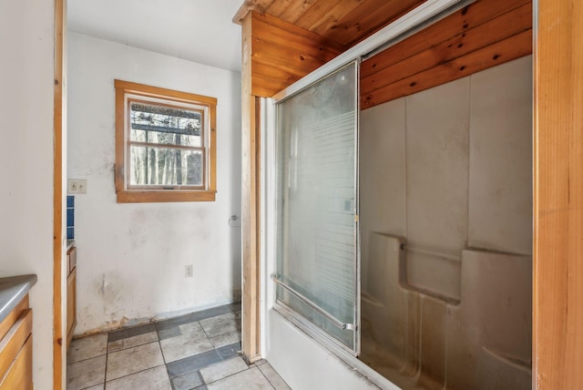 bathroom featuring shower / bath combination with glass door and vanity